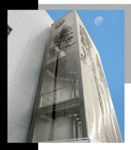Close-up detail of decorative metal mesh facade with tree decoration, Pure Metal Tech® by Dreamet